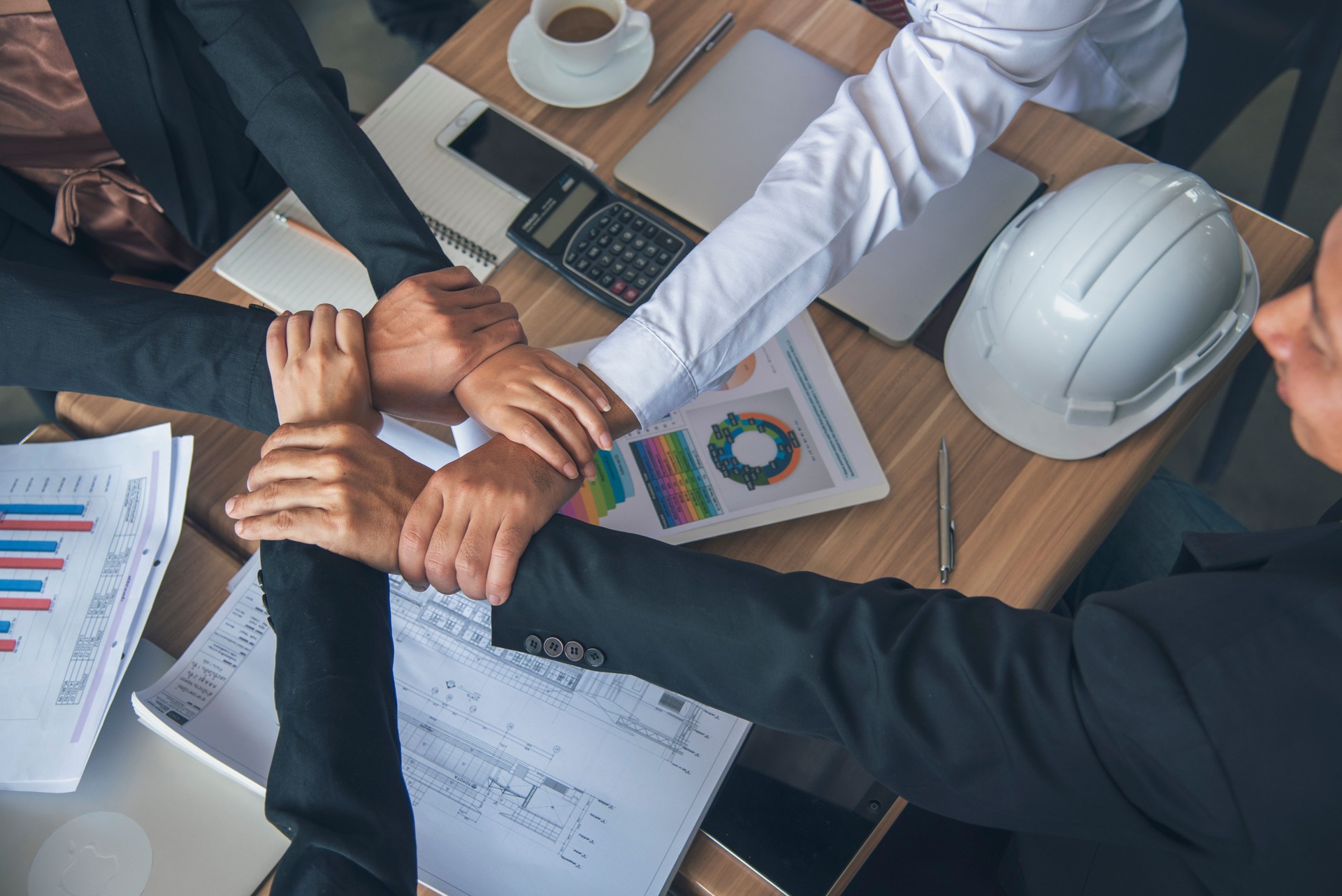Partners hands together teamwork group of business people meeting in firm company office. Diversity Hands join empower partnership teams connection community. Success Mergers acquisitions partnership